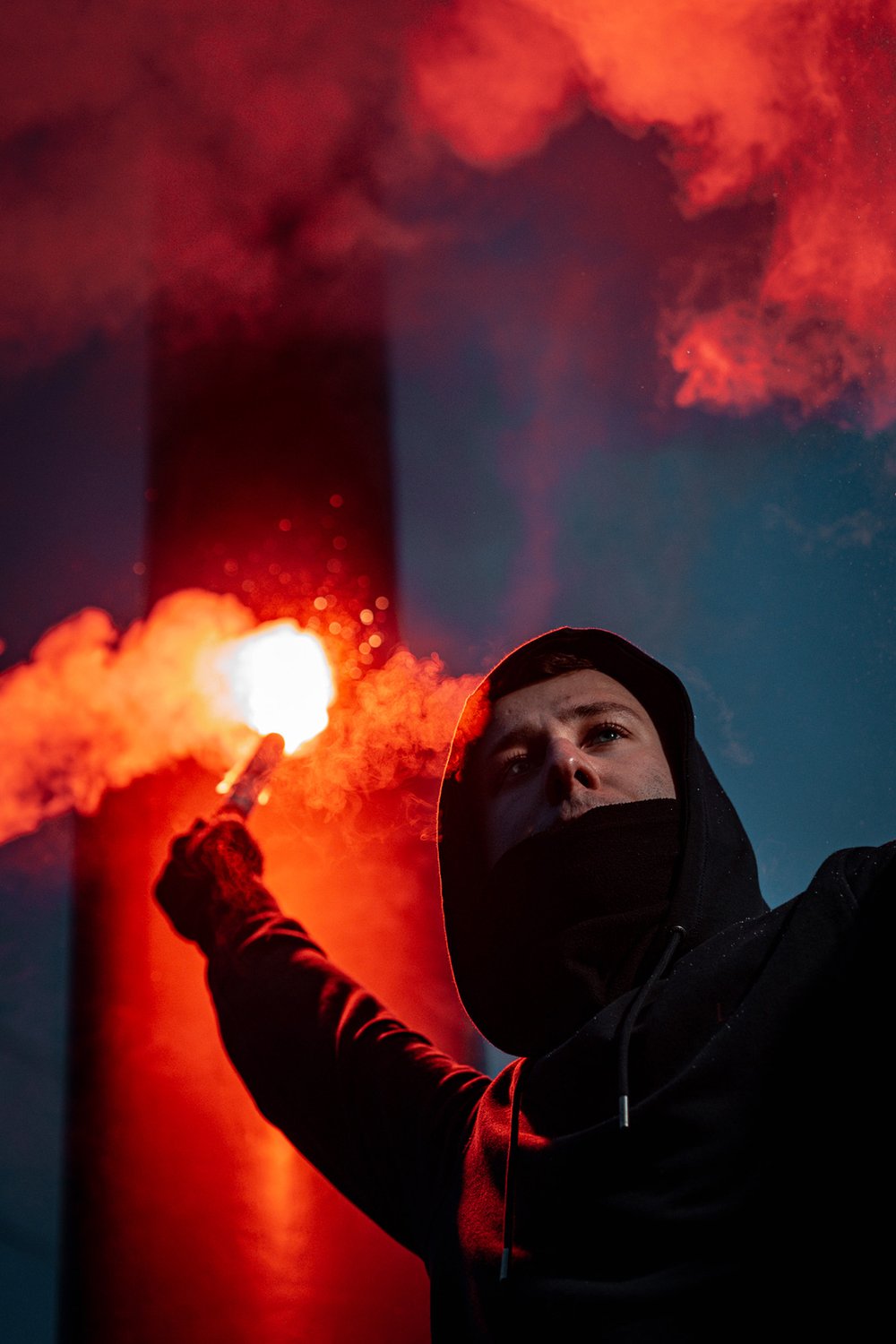 Demonstrator at night holding a flaming torch