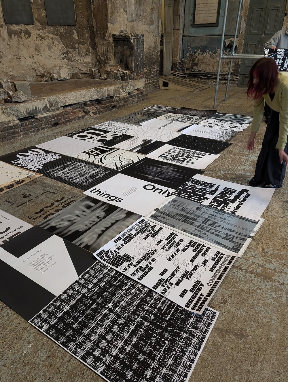 posters laid out on the floor before installation
