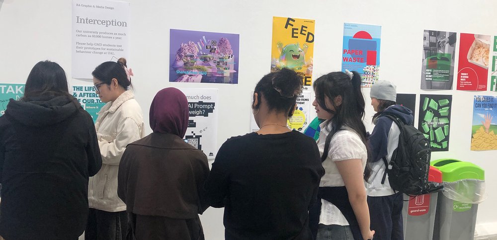 Students looking at posters on a wall display